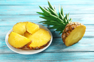 Ripe pineapples on a blue wooden table