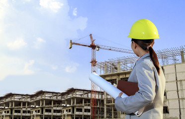 portrait women asia engineer working and holding blueprints at c