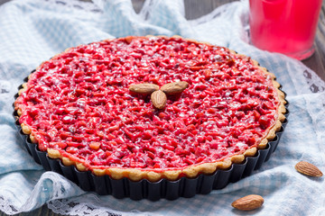 Homemade pink praline tart, almond tart.