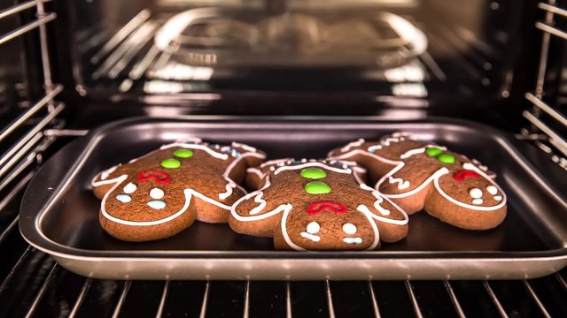 Baking Gingerbread man in the oven. Cooking in the oven.