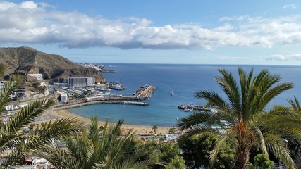 The beautiful puerto rico beach. View from the hill of Puerto Rico, Gran Canaria, Spain