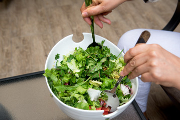 Cook make salad from greens