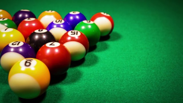 Billiard balls on green baize