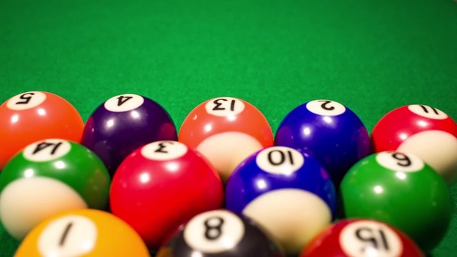 Billiard balls on green baize