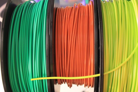 Three multi-color 3d printing filament spools