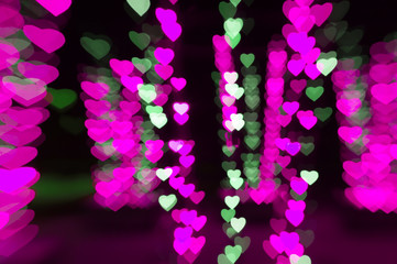 abstract pink background bokeh of hearts for Valentine's day