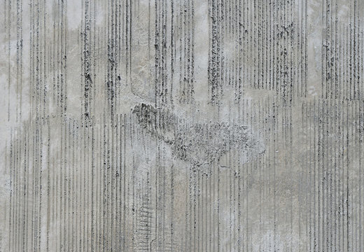 Concrete wall with traces from rubbed finish processing