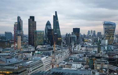 Wall murals London LONDON, UK - JANUARY 27, 2015: City of London at sunset, business and banking aria aerial view