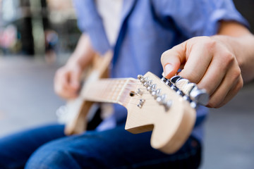 Hands of musician with guitar