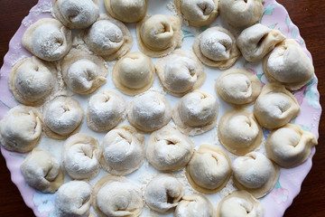 Meat dumplings russian pelmeni on dish