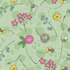 Wild meadow flowers on green freehand drawing seamless pattern