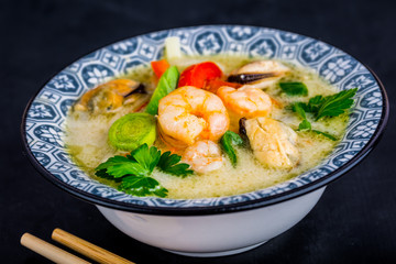 Fototapeta na wymiar Asian soup with prawns, Tom Yam Kung . Thai cuisine.