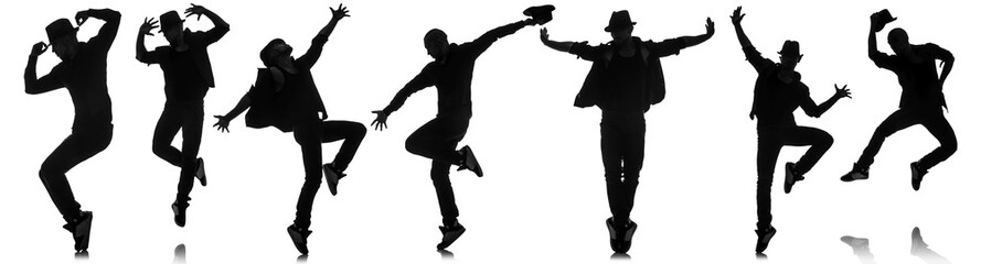 Silhouettes of dancers in dancing concept