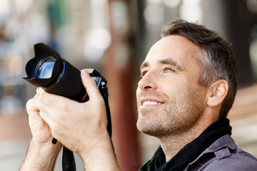 Male photographer taking picture