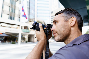 Male photographer taking picture