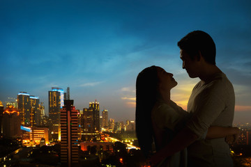 Silhouette of couple on the rooftop