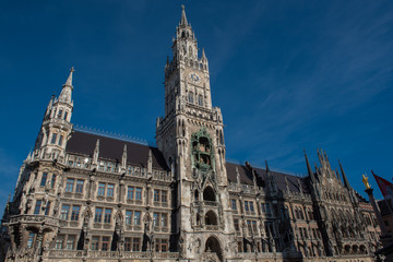 Fototapeta na wymiar Munich town hall detail in the sun against blue sky