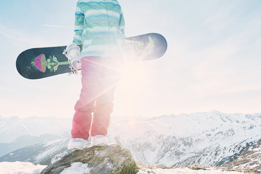 Young woman with snowboard