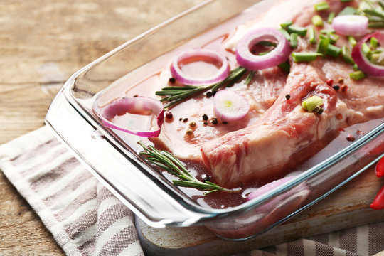 Marinating Meat With Spices On Wooden Table