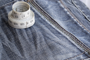 Background of denim with the measuring tape
