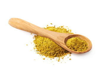 Pile of yellow curry seasoning isolated
