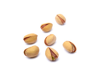 Pile of fresh pistachios isolated on white background