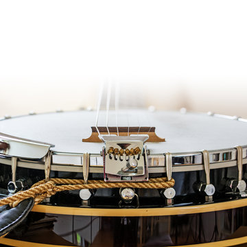 detail of a banjo, country music instrumen, background fades to