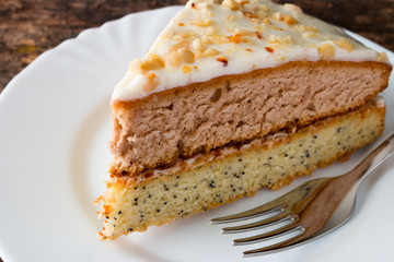homemade cake on a white plate with a fork