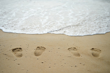Fototapeta na wymiar Couple Footprints on beach