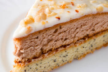 cut a piece of cake on white plate closeup