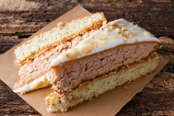 homemade cake on a paper on the wooden background