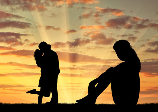 Silhouette  lonely woman looking at loving couple