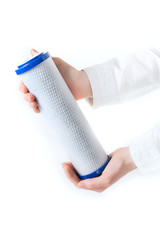 Obraz premium water filter cartridge in human hand
