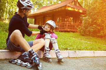 Dad and daughter in a helmet