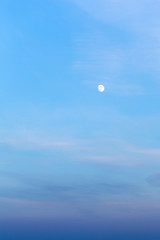 full moon in blue twilight sky