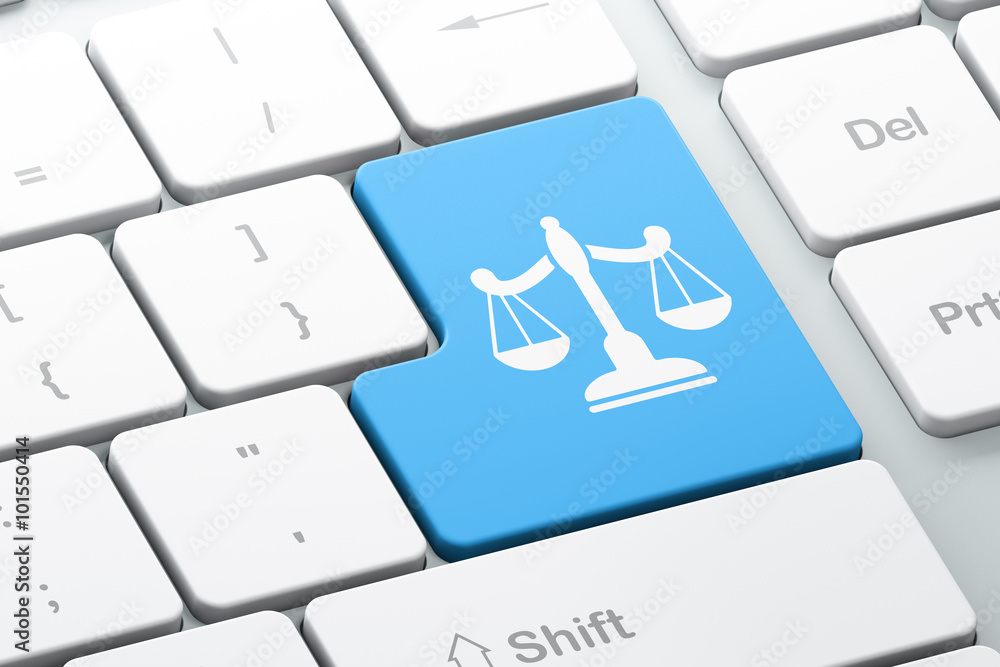 Poster law concept: scales on computer keyboard background