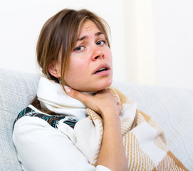 Naklejka premium Girl suffering of sore throat