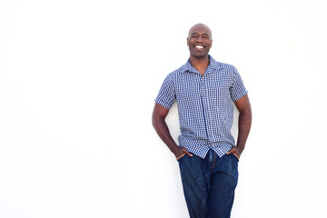 Happy african man standing against white background