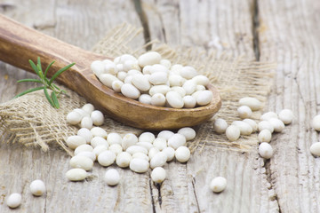 wooden spoon with white beans