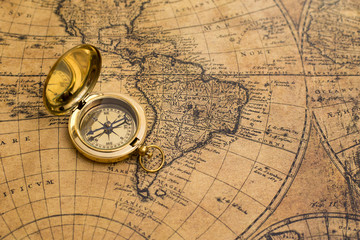 Naklejka na ściany i meble old compass on vintage map