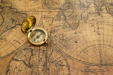 old compass on vintage map