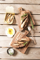 Fototapeta na wymiar Sandwich Tapas with sardines, sprats olives and salt