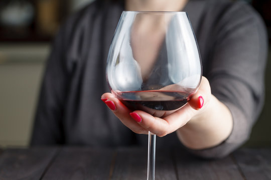 Woman Drinking Alcohol On Dark Background