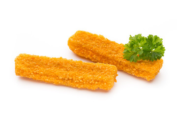 Frozen bread crumbed fish fingers on white.