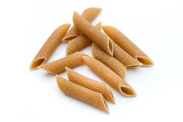 Rye flour macaroni pasta close up isolated on white.