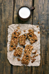 Muesli and cup of milk, top view