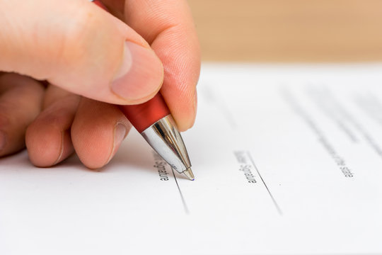 Closeup of businessman  signing contract