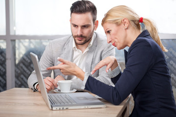 Young businesspeople working at coffee shop