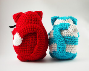 couple knitted toy cats. cat lovers, looking into the distance and dreaming