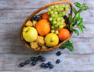 Wicker straw basket with an assortment of fruits